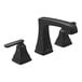 A close-up of a Delta Ashlyn widespread lavatory faucet with black lever handles and metal pop-up drain.