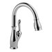 A Delta kitchen faucet with a chrome finish and a gooseneck spout.