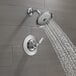 A Delta T-series Woodhurst shower faucet with chrome shower head and knob.