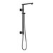 A matte black Delta shower column with a hose and hand held shower head.