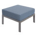 A BFM Seating Belmar gray metal ottoman with Sunbrella Haze blue cushion.