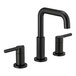 A Delta Nicoli matte black deck-mount faucet with lever handles and push pop-up drain.