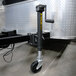A white and black Trailer Valet JX 2,000 lb. Capacity Tongue Jack with a wheel.