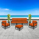A BFM Seating Belmar black frame sofa and chairs with Sunbrella Tamale cushions on a patio.