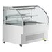 An Avantco white refrigerated display case with a glass door.