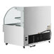 An Avantco white horizontal air curtain merchandiser with a glass door.