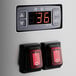 The digital display and switches on an Avantco horizontal air curtain merchandiser.