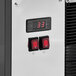 A close up of a black and white control panel on an Avantco refrigerated air curtain merchandiser.