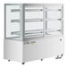 An Avantco white square dry bakery display case with glass doors and LED lighting.