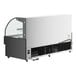 An Avantco black horizontal air curtain merchandiser with glass doors and LED lighting.