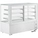 An Avantco white square dry bakery display case with glass shelves.