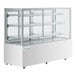 An Avantco white refrigerated bakery display case with glass shelves.