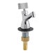 A silver Regency dipper well faucet with brass accents.