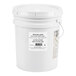 A white bucket with a label reading "Dutch Gold Raw Wildflower Honey"