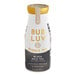 A white and gold Bubluv bottle of black milk tea with jelly pearls.