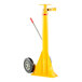 A yellow Vestil portable trailer stabilizing ratchet jack with a red handle.