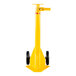 A yellow cylindrical Vestil trailer stabilizing jack with black wheels.