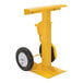 A yellow metal Vestil stabilizing jack with pneumatic wheels.