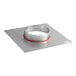 A round metal NAKS fan plate adapter with a red band on the edge.