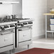 A Garland commercial liquid propane range with a convection oven in a professional kitchen.