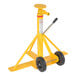 A yellow steel trailer stabilizing jack with wheels.