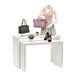 A mannequin with a skirt and a pink purse on a white Glossy White Melamine nesting display table.