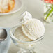 A bowl of Lloyd's of Pennsylvania condensed milk ice cream with a spoon.