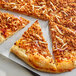 A slice of pizza with Gardein Italian Pizza Crumbles and cheese on top.