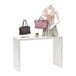 A mannequin with a purse on a Glossy White Melamine Display Table.