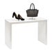 A white Glossy White Melamine Display Table with a brown purse and a pair of high heels on it.