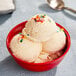 A bowl of Lloyd's of Pennsylvania cake batter ice cream with sprinkles on top.