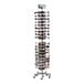 A white steel mobile eyewear spinner rack holding many pairs of glasses.