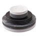 A stack of American Metalcraft matte black melamine coupe plates on a white surface.