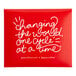 A red Aunt Flow sign with white text reading "changing the world one cycle at a time"