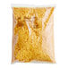 A clear bag of Daiya Vegan Shredded Sharp Cheddar Cheese.