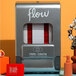 A wall-mount Aunt Flow sanitary napkin dispenser with red and white text on it.