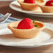 A KEEBLER Ready Crust Mini Graham Pie Shell with a strawberry on top.