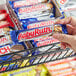 A person holding a BABY RUTH candy bar