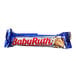 A close-up of a BABY RUTH Full Size chocolate bar in a blue wrapper.