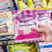 A hand holding a package of MOTHER'S Circus Animal Cookies.