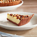 A slice of chocolate pie in a KEEBLER® chocolate graham pie shell on a plate.