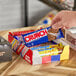 A variety pack of full size Ferrero chocolate bars including Crunch and Butterfinger displayed in an open box.