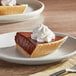 A slice of KEEBLER Ready Crust Shortbread pie with whipped cream on top.