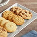 A plate of KEEBLER cookies on a wood table.