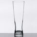 A clear Libbey Pilsner glass on a table.