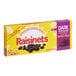 A yellow RAISINETS box with dark chocolate-covered raisins on it.