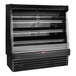 A black Howard McCray vertical open air curtain produce merchandiser with 3 shelves.