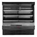 A black Howard McCray horizontal open air curtain produce merchandiser with shelves.