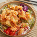 A bowl of Nasoya mild kimchi on a table with chopsticks.