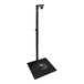 A black metal stand with a round base.